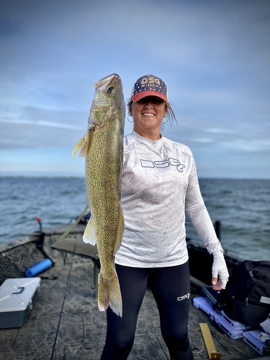 Amy Diekevers holds a walleye caught on the Detroit River